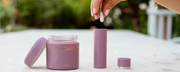 Woman placing WeNatal prenatal vitamins for women into a travel vial - WeNatal